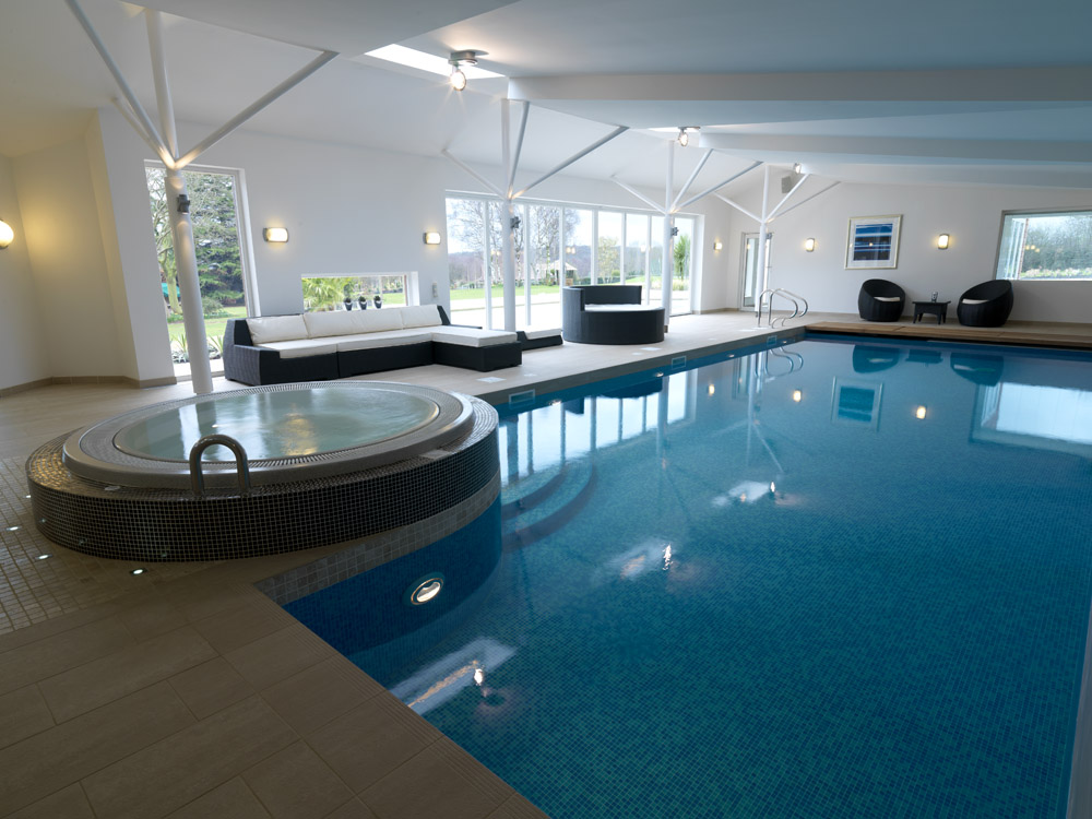 Indoor swimming pool with sitting area