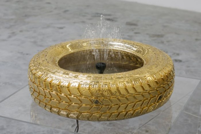Tire Turns Golden Fountain